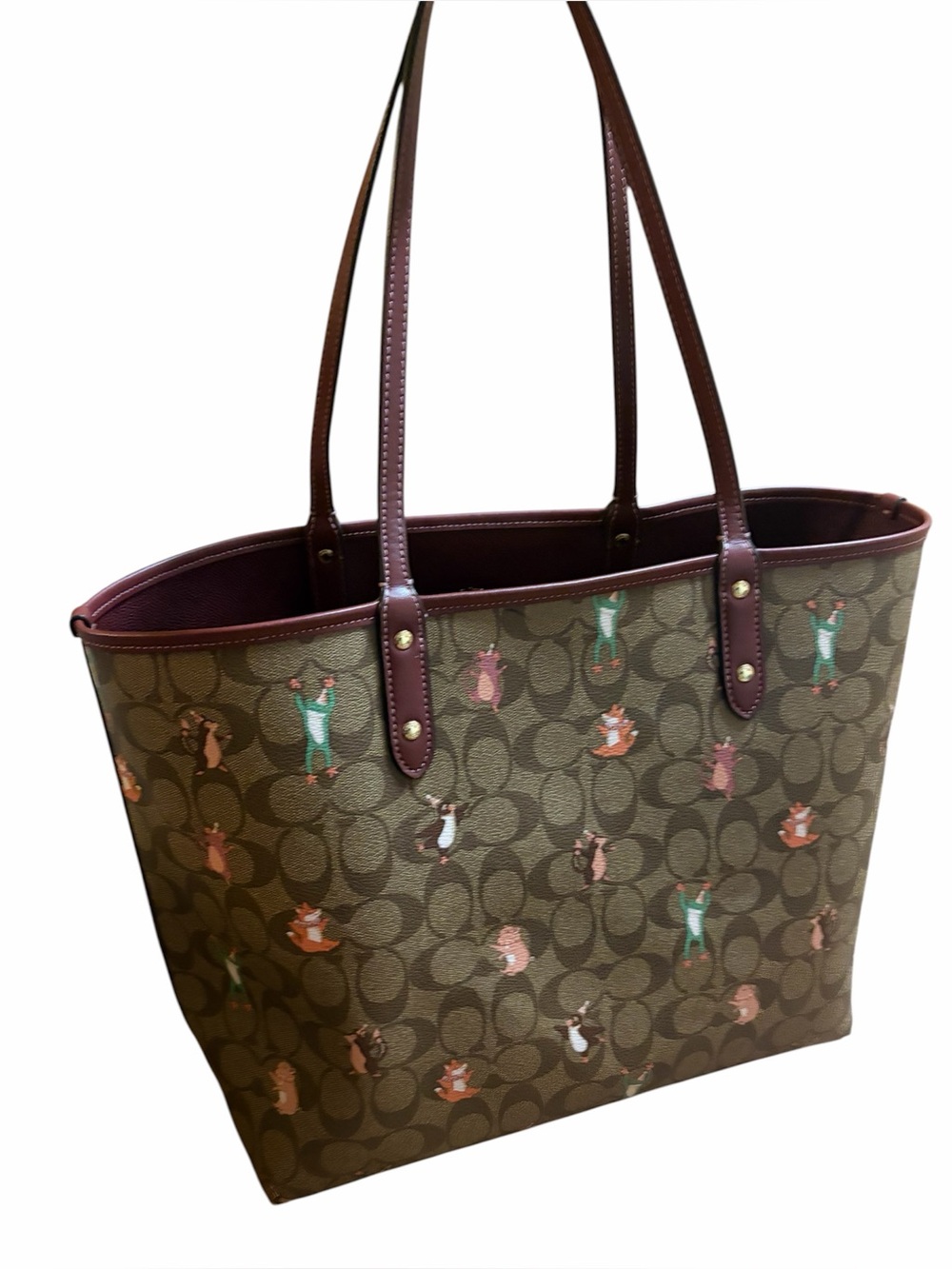 REVERSIBLE CITY COACH TOTE IN SIGNATURE CANVAS WITH PARTY ANIMAL PRINT Burgundy